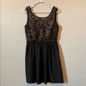 Flora gold and black dress